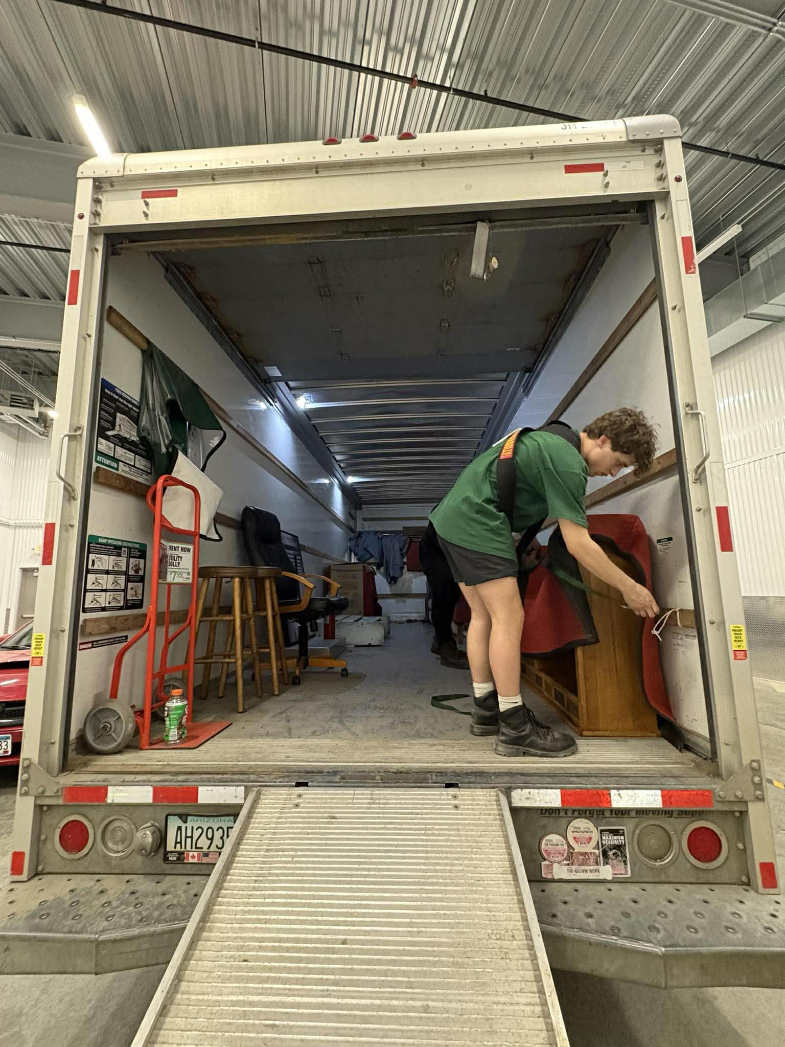 Gama loading furniture tight into a Dakota Moving truck in Fargo